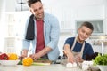 Dad and son cooking together Royalty Free Stock Photo