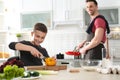 Dad and son cooking together in Royalty Free Stock Photo