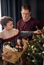 dad and son decorating Christmas tree. Funny family at home in living room. Royalty Free Stock Photo
