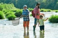 Dad and son fishing at lake. Grandfather, father and grandson fishing together. Grandson with father and grandfather Royalty Free Stock Photo