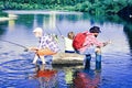 Dad and son fishing at lake. Three men fishing on river in summer time. Happy grandfather and grandson are fishing on Royalty Free Stock Photo