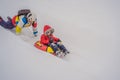 Dad and son have fun on tubing in the winter. Winter fun for the whole family Royalty Free Stock Photo