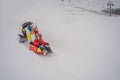 Dad and son have fun on tubing in the winter. Winter fun for the whole family Royalty Free Stock Photo