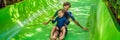 Dad and son have fun at the water park BANNER, LONG FORMAT Royalty Free Stock Photo