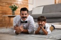 Dad and his son having fun at home. Happy Father`s Day Royalty Free Stock Photo