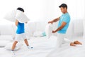Dad and son having fun. Pillow fight. Royalty Free Stock Photo