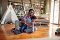 A Dad and a son having a fun together while playing at home. Family, together, love, playtime Royalty Free Stock Photo
