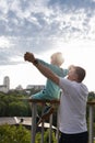 dad and son holding hands look at city in front of them. concept of freedom and self-confidence Royalty Free Stock Photo