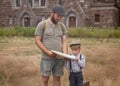 dad and son are looking at the route on the map Royalty Free Stock Photo