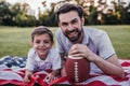 Dad with son playing baseball