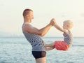 Dad and son are playing on the beach. Fun pastime Royalty Free Stock Photo