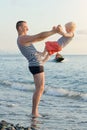 Dad and son are playing on the beach. Fun pastime Royalty Free Stock Photo