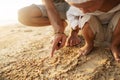 Dad and son playing on the sand at the beach at sunset Royalty Free Stock Photo