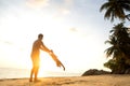 Dad and son playing on the sand at the beach at sunset Royalty Free Stock Photo