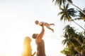 Dad and son playing on the sand at the beach at sunset Royalty Free Stock Photo