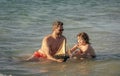 dad and son playing together. happy moments with father and son. Father son beach adventure playing with toy ship Royalty Free Stock Photo