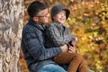 Dad and son playing together outdoors in the park Royalty Free Stock Photo