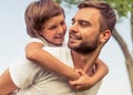 Dad and son resting outdoors Royalty Free Stock Photo