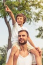 Dad and son resting outdoors Royalty Free Stock Photo