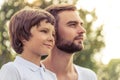 Dad and son resting outdoors Royalty Free Stock Photo