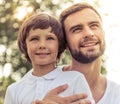 Dad and son resting outdoors Royalty Free Stock Photo