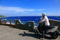 Dad with Son riding motorcycle on the Coastline, Green Island.