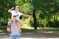 Dad and son with rugby ball outdoors Royalty Free Stock Photo