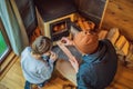 Dad and son spend time by the fireplace in Glamping. Rest in the mountains in Glamping. Cozy fireplace in a mountain