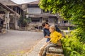 Dad and son tourists in abandoned and mysterious hotel in Bedugul. Indonesia, Bali Island. Bali Travel Concept