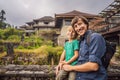 Dad and son tourists in abandoned and mysterious hotel in Bedugul. Indonesia, Bali Island. Bali Travel Concept