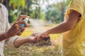 Dad and son use mosquito spray.Spraying insect repellent on skin outdoor Royalty Free Stock Photo