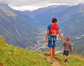 Dad with son walking in mountains