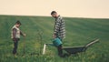 The dad and son watering a new tree. Royalty Free Stock Photo