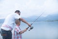 Dad teach his son fishing Royalty Free Stock Photo