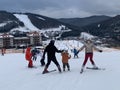 Dad teaches the child to ski. Father and son go down the mountain in the snow. A family with a child goes downhill skiing Royalty Free Stock Photo