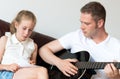 Dad teaches daughter. Royalty Free Stock Photo