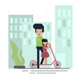 Dad teaches daughter to ride a scooter Royalty Free Stock Photo