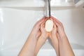 Dad teaches daughter washing hands. prevention. Royalty Free Stock Photo