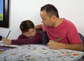 Dad teaches his son how to paint Royalty Free Stock Photo