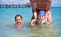 Dad teaches you to swim the youngest son in the Mediterranean Sea next to your eldest daughter.