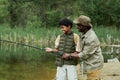 Dad teaching his son fishing Royalty Free Stock Photo