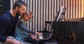 Dad teaching piano to his daughter.Little girl learning piano at home.Side view.Piano class at home. Child learning Royalty Free Stock Photo