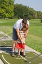 Dad Teaching Son Golf Royalty Free Stock Photo