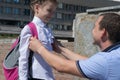 Dad tells his daughter how good at school, they smile