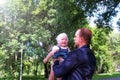 Dad throws his daughter in air and catches in city park during walking. Royalty Free Stock Photo