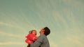 Dad toss up a child skyward. father threw the baby to the sky. happy family concept. dad plays with kid Royalty Free Stock Photo