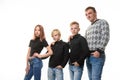 Dad, two sons and a daughter in casual clothes in dark colors, white background Royalty Free Stock Photo