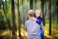 Dad walks in the park with his beloved daughter at sunset Royalty Free Stock Photo