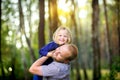 Dad walks in the park with his beloved daughter at sunset Royalty Free Stock Photo