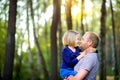 Dad walks in the park with his beloved daughter at sunset= Royalty Free Stock Photo